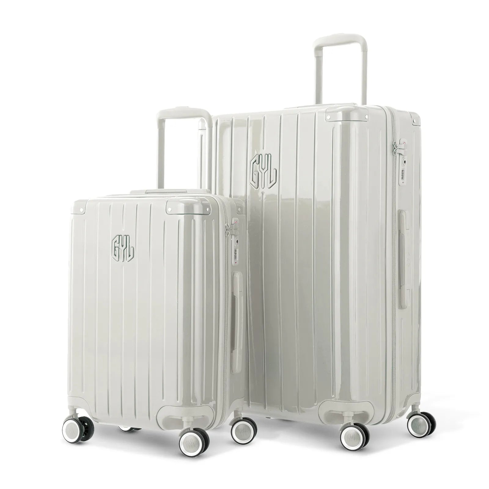 Duo de valises rigides GYL Intemporelle sable avec coques nervurées et poignées télescopiques.