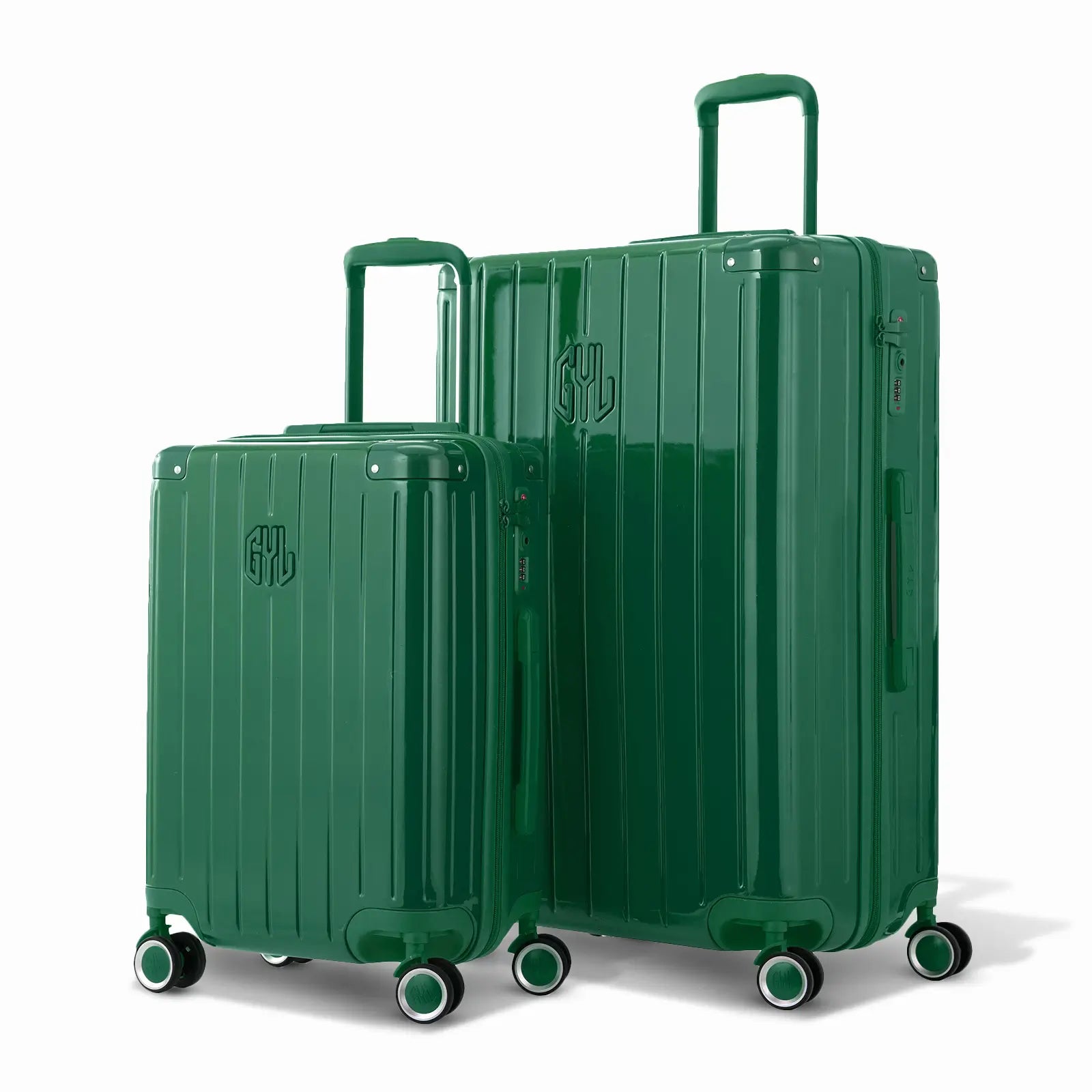 Duo de valises rigides GYL Intemporelle sapin avec coques nervurées et poignées télescopiques.