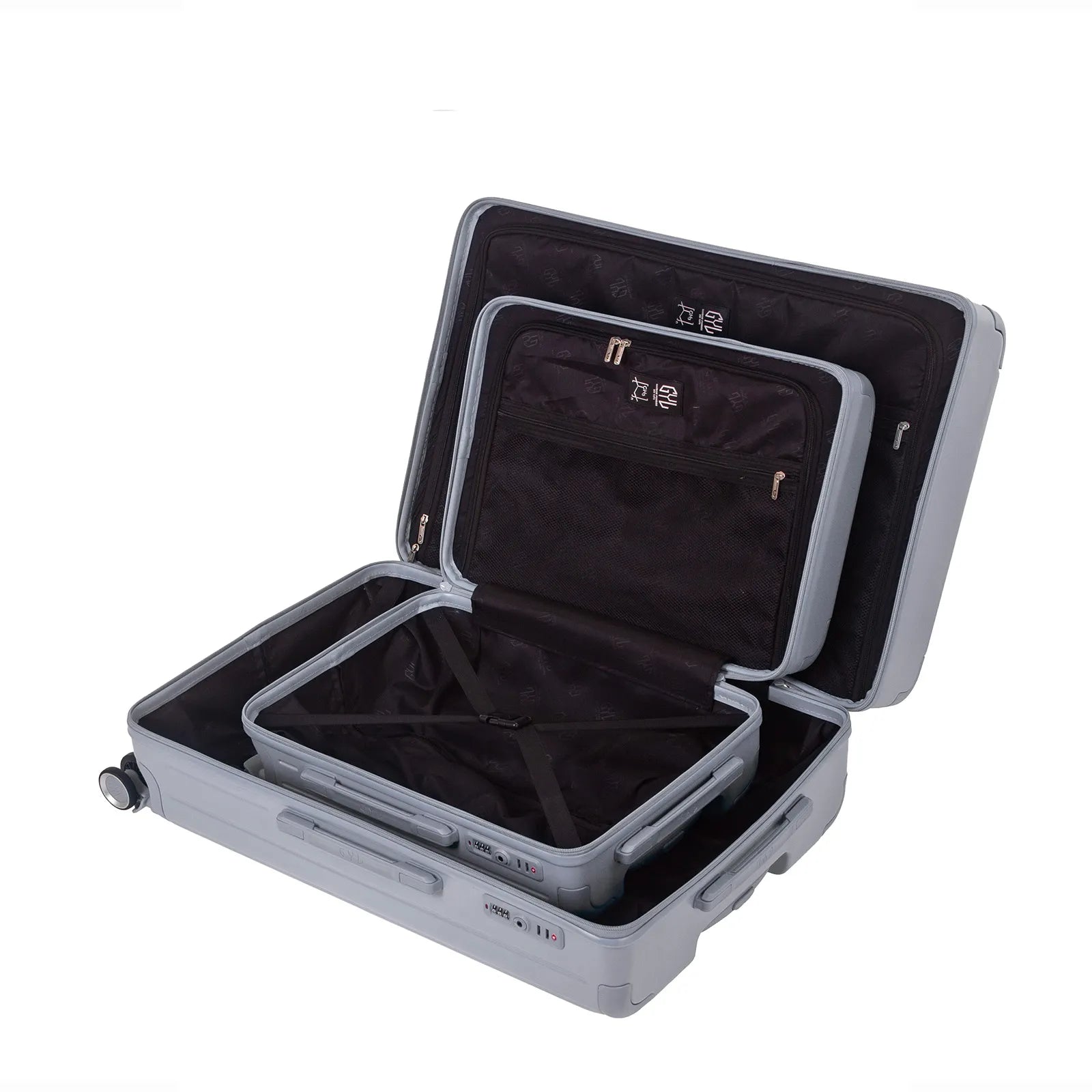 Intérieur compartimenté de la valise GYL Intemporelle argent avec sangles croisées et poches filet.