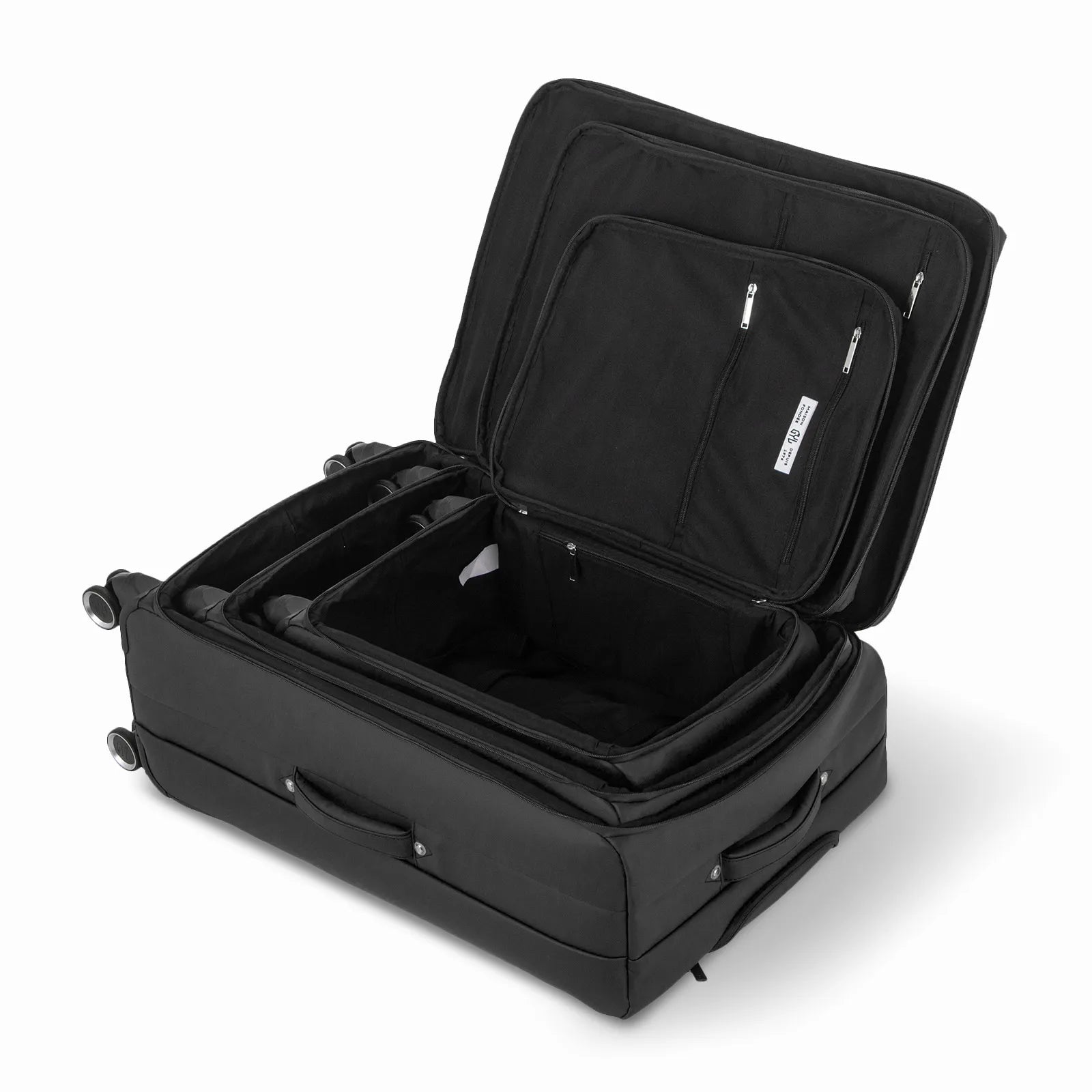 Ensemble de trois valises GYL Évasion en polyuréthane noir, ouvertes et imbriquées les unes dans les autres pour montrer leur conception pratique et leur intérieur spacieux.