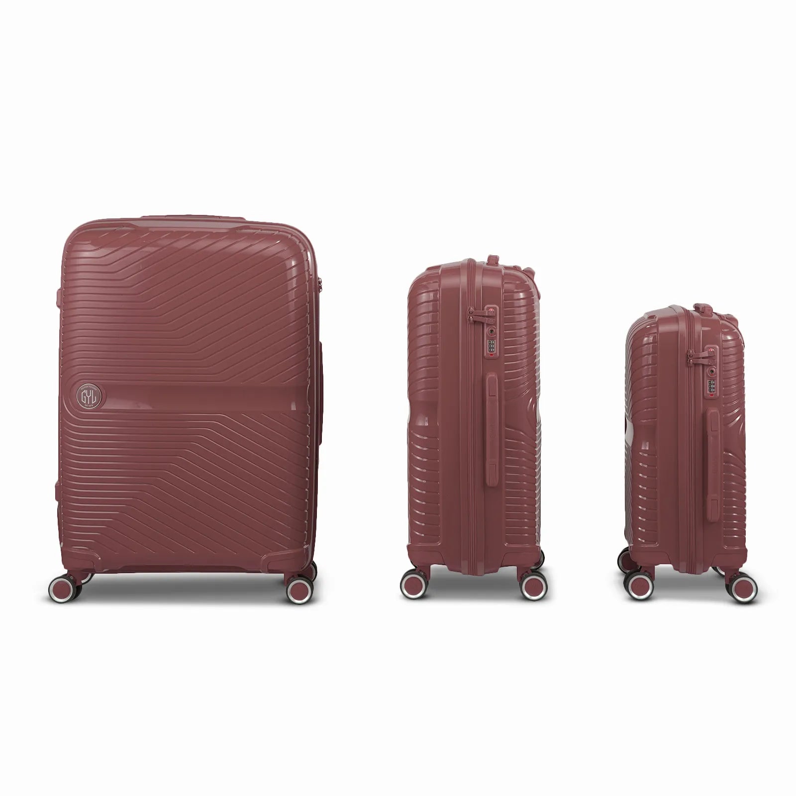 Ensemble de trois valises GYL Signature en polypropylène couleur rose gold, présentées alignées de face et de profil, incluant les formats cabine, moyenne et soute.