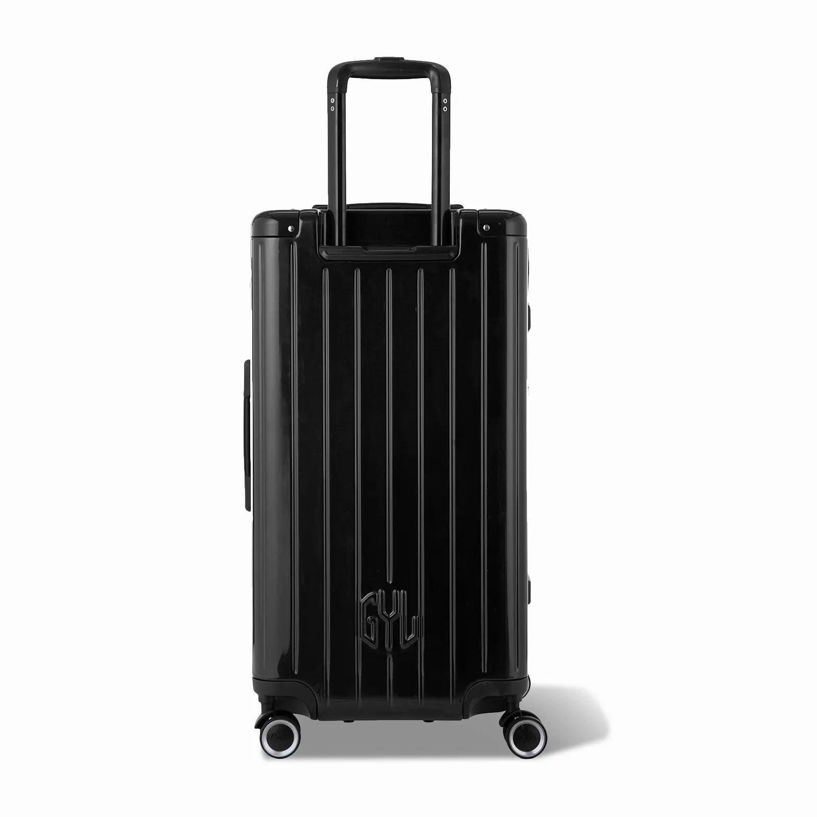 Dos de la valise trunk GYL L noir avec trolley télescopique sorti et logo embossé.