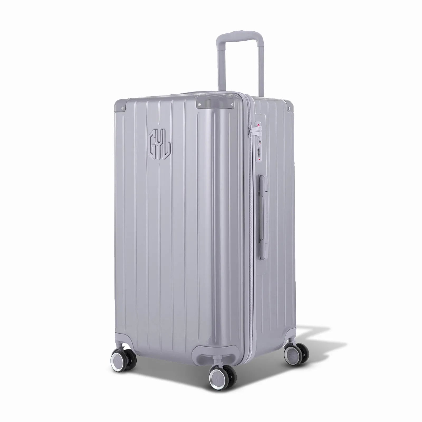 Valise trunk GYL taille L en polycarbonate argent vue de trois quarts, avec trolley déployé et roues 360°