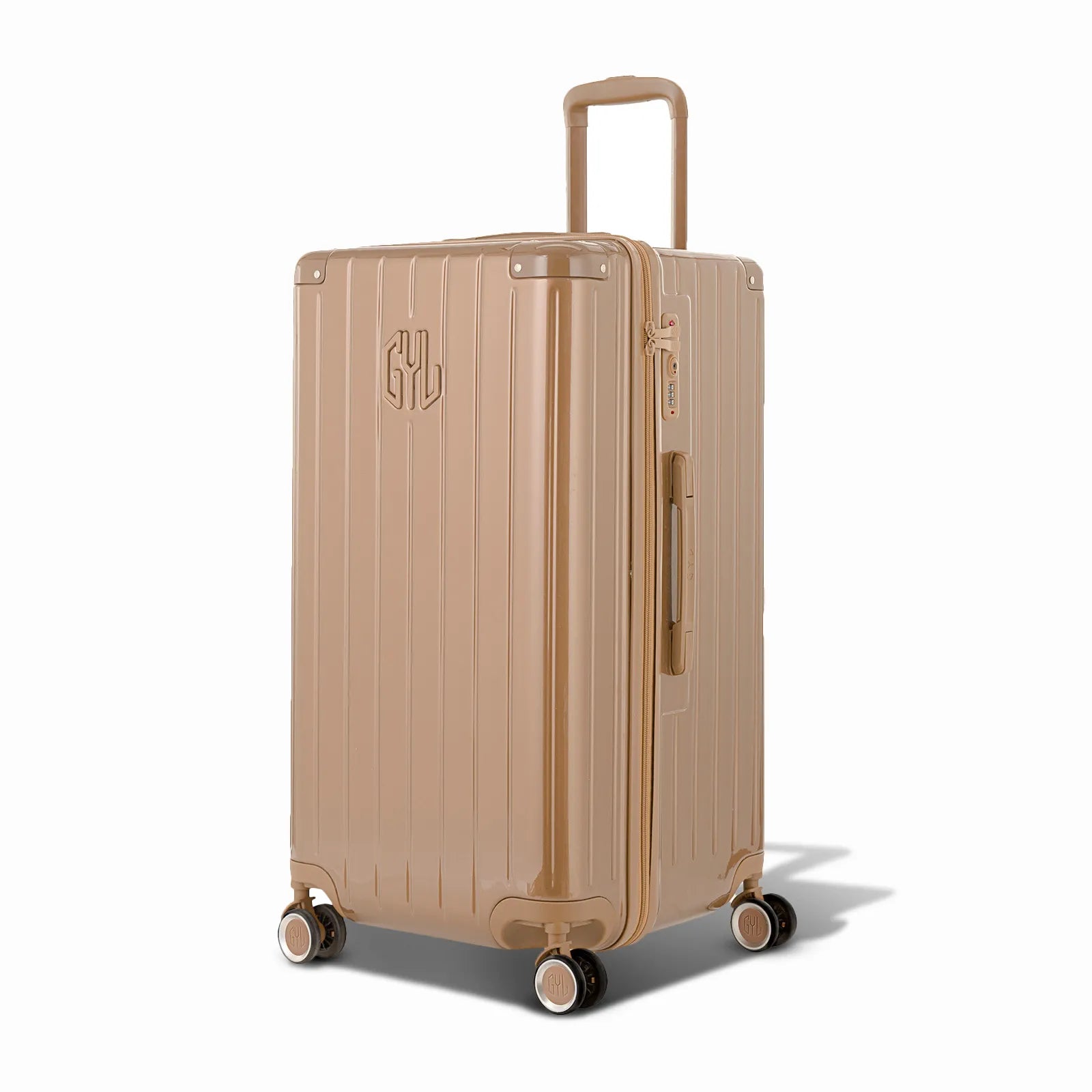 Valise trunk GYL taille L en polycarbonate champagne vue de trois quarts, avec trolley déployé et roues 360° #couleur_champagne