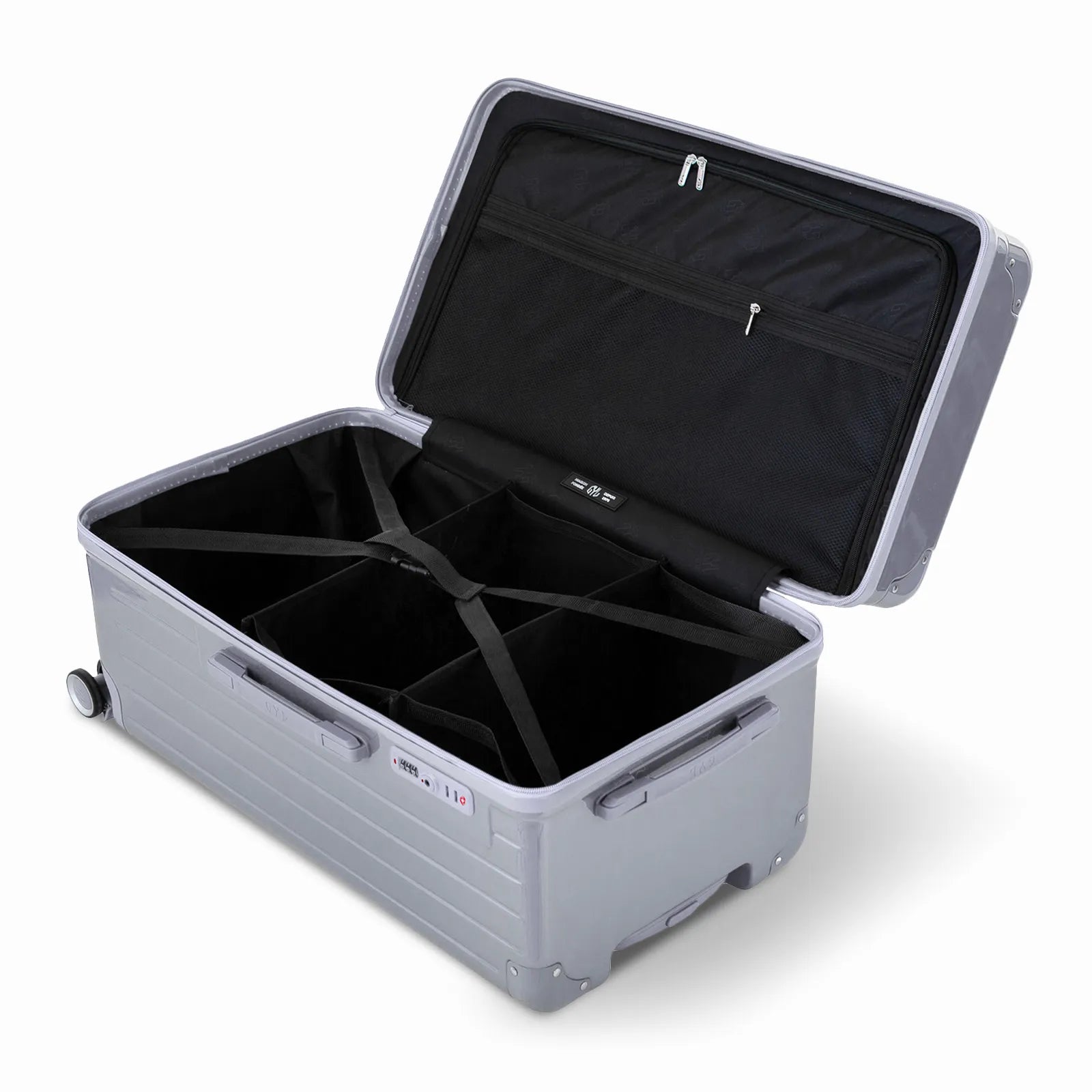 Intérieur de la valise trunk GYL L argent ouvert, avec sangles croisées et compartiments de rangement
