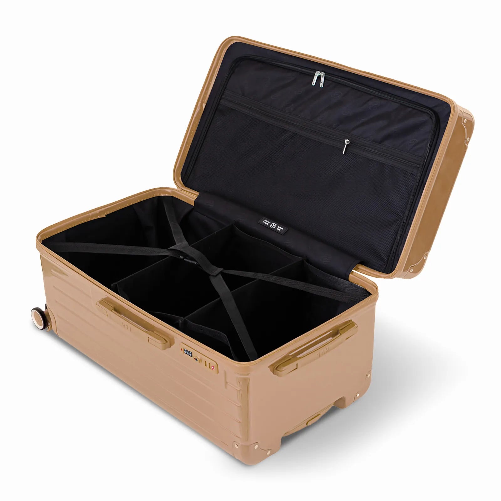 Intérieur de la valise trunk GYL L champagne ouvert, avec sangles croisées et compartiments de rangement