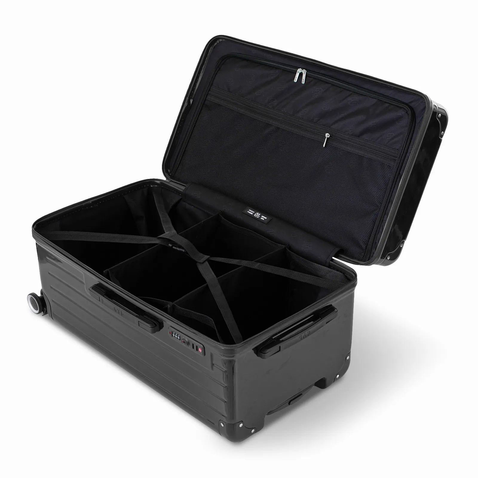 Intérieur de la valise trunk GYL L noir ouvert, avec sangles croisées et compartiments de rangement