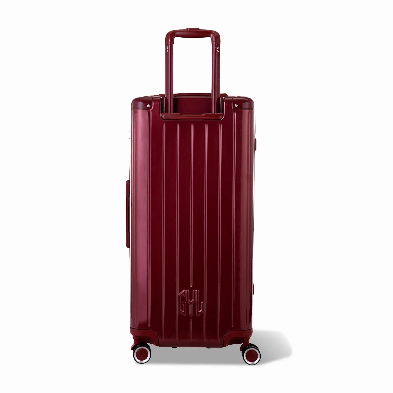 Dos de la valise trunk GYL XL rouge foncé avec trolley télescopique sorti et logo embossé.
