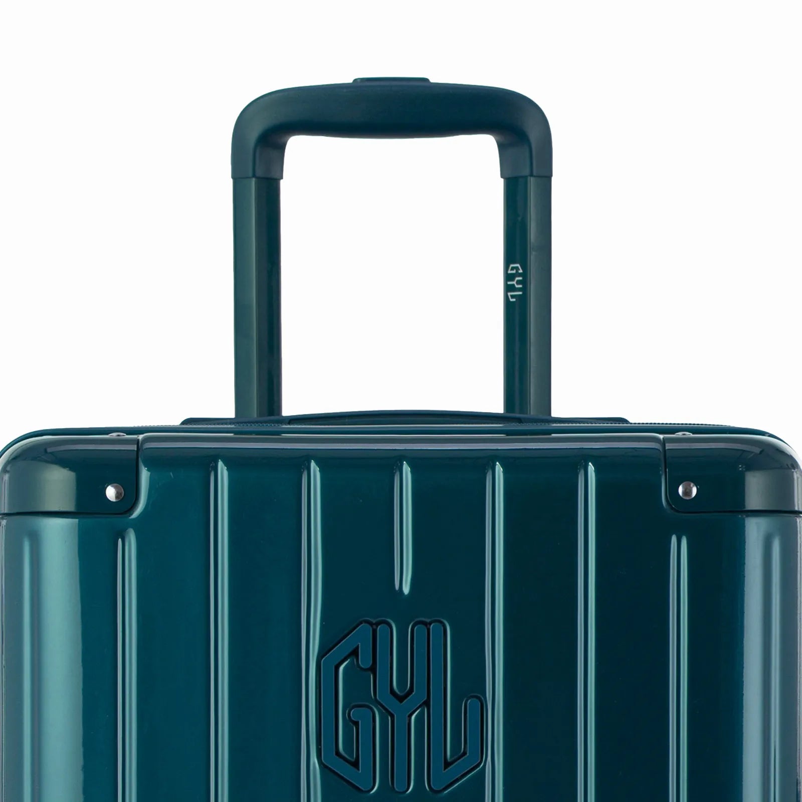 Zoom sur la poignée trolley et le logo GYL de la valise trunk sapin.
