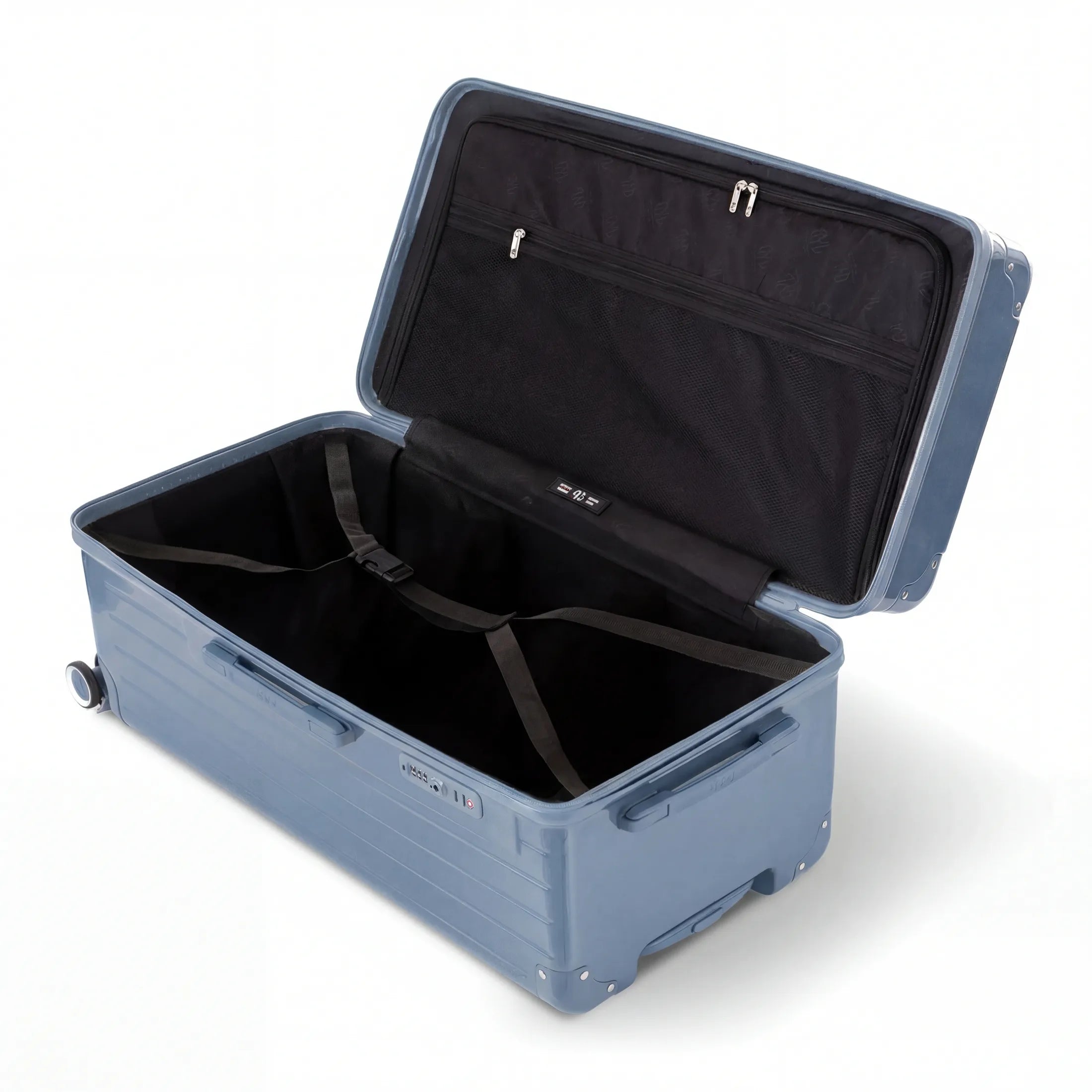 Intérieur de la valise trunk GYL XL bleu gris foncé ouvert, avec sangles croisées.
