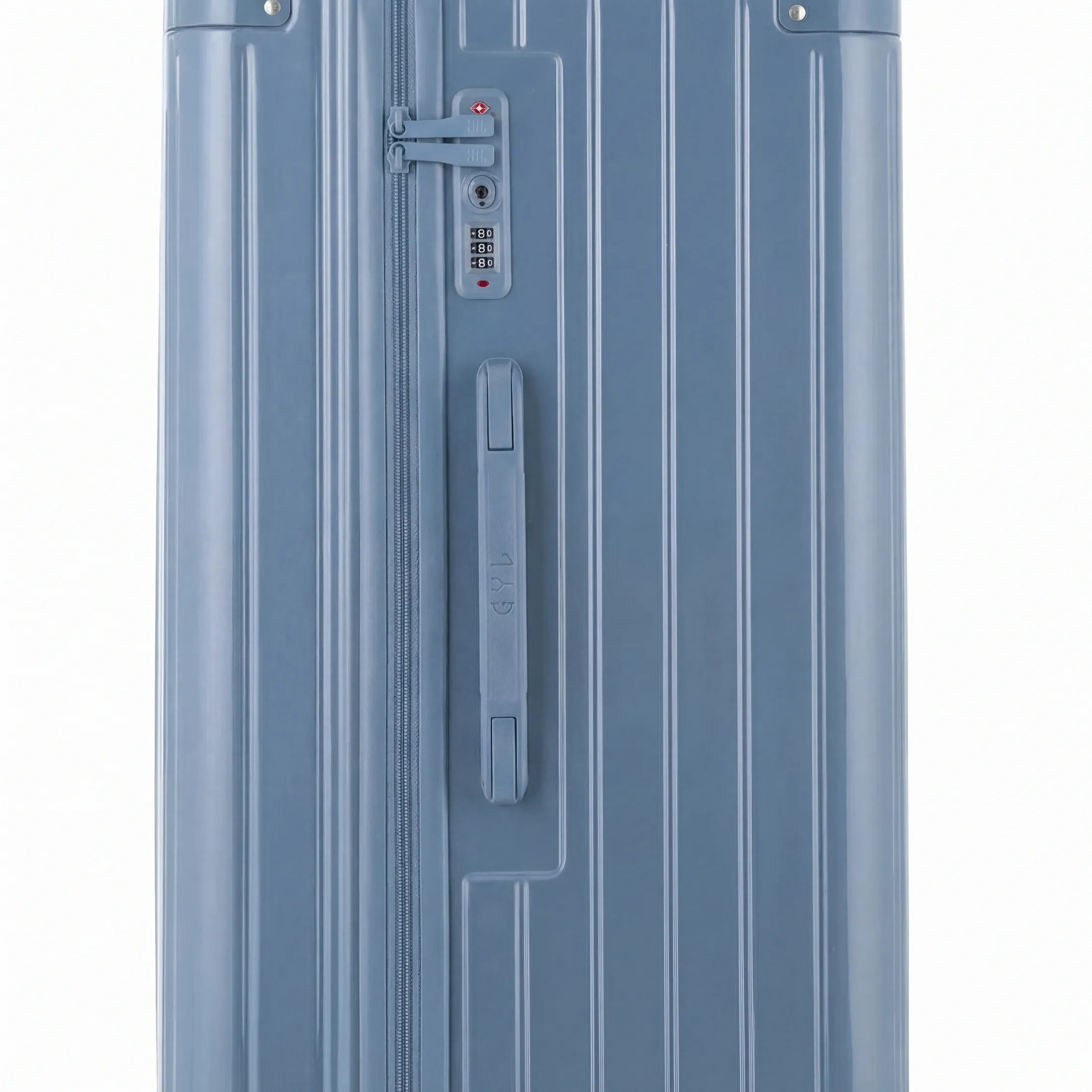 Détail de la serrure TSA et de la poignée latérale sur la valise trunk bleu gris.
