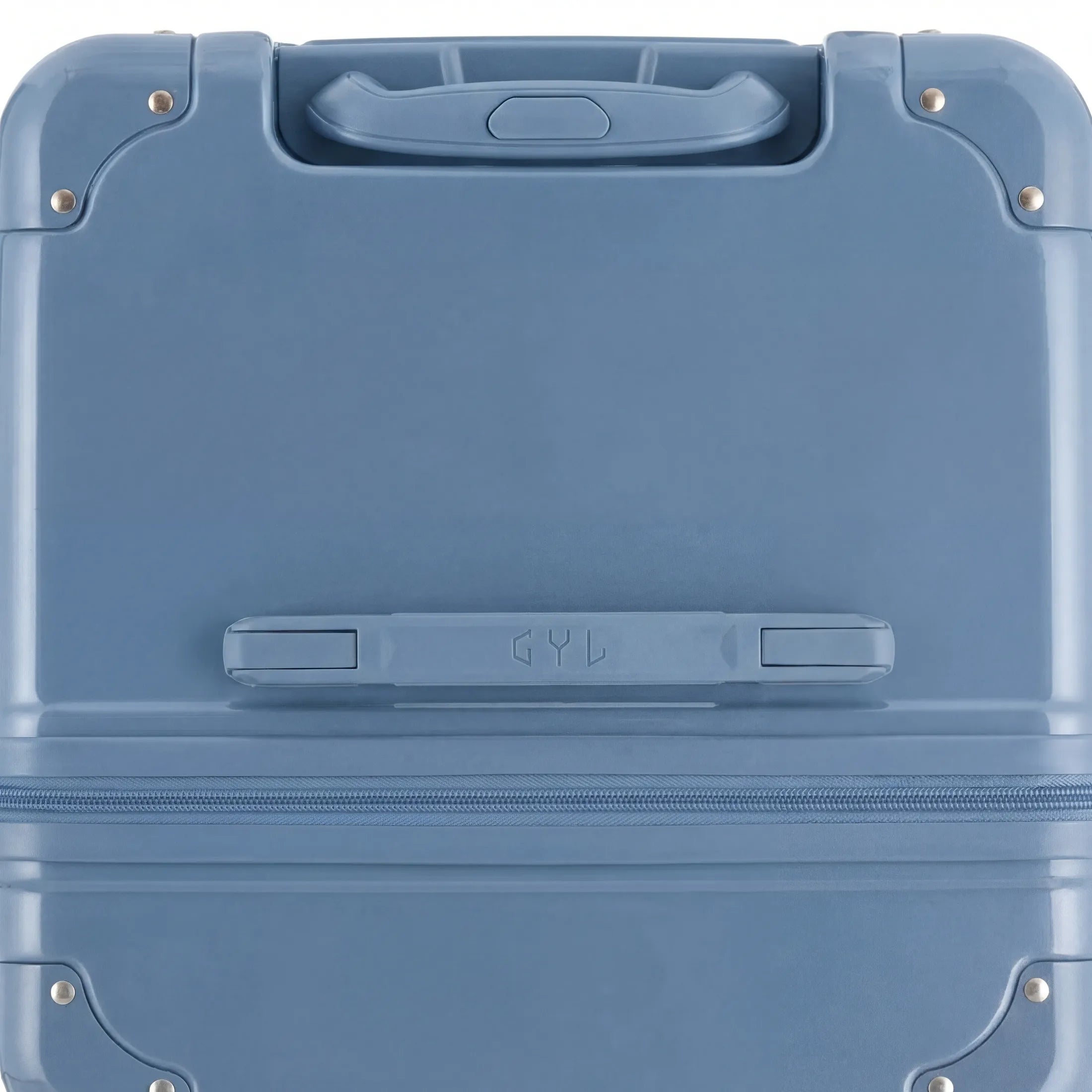 Vue du dessus de la valise trunk GYL bleu gris en polycarbonate, avec poignée centrale et coins renforcés.