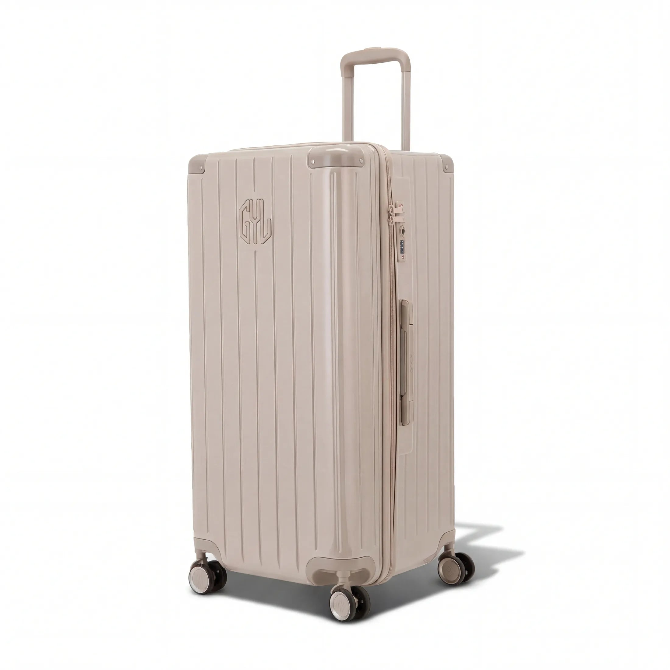 Valise trunk GYL taille XL en polycarbonate nude vue de trois quarts, avec trolley déployé et roues 360°.