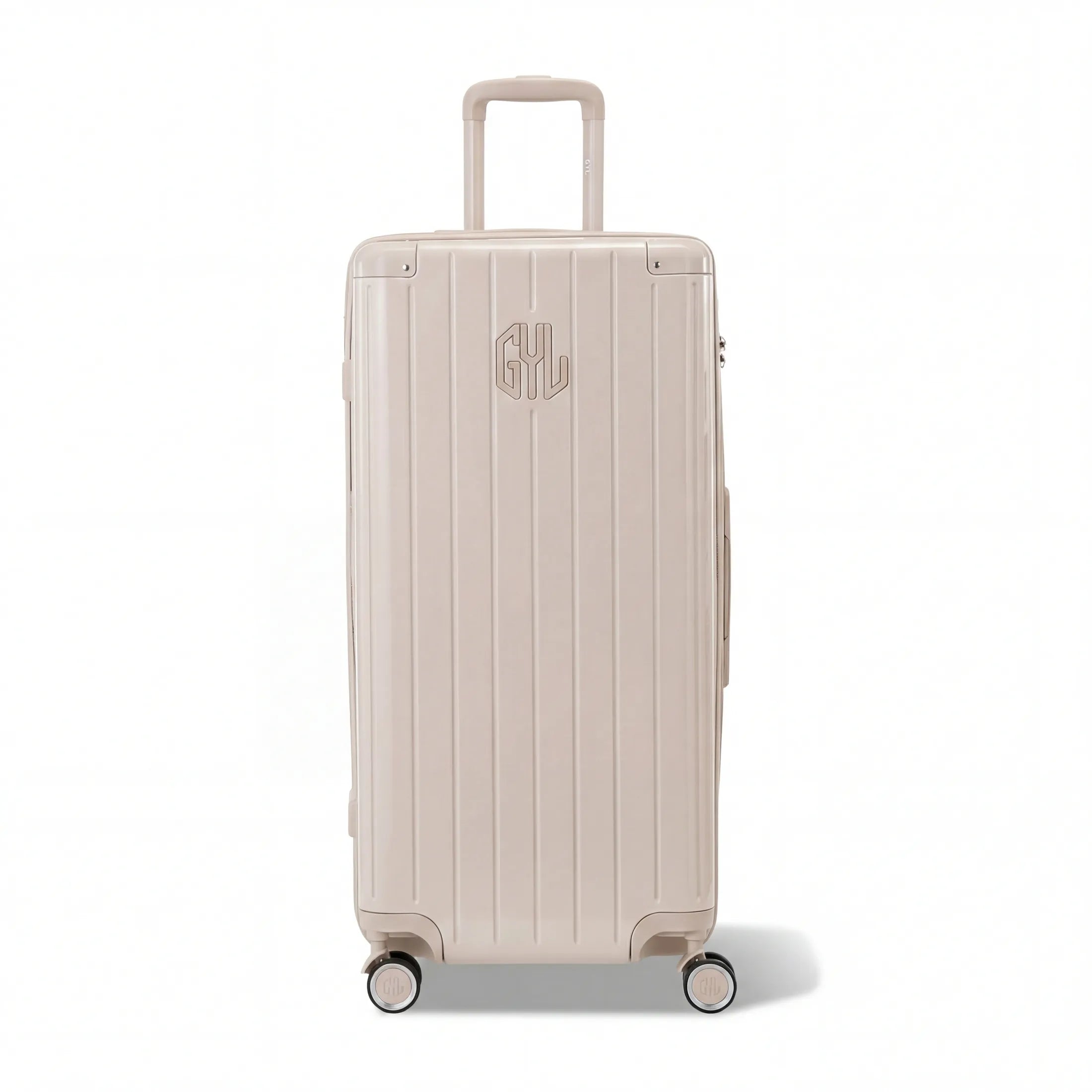 Valise trunk GYL taille XL en polycarbonate nude vue de face, avec trolley déployé et roues 360°.