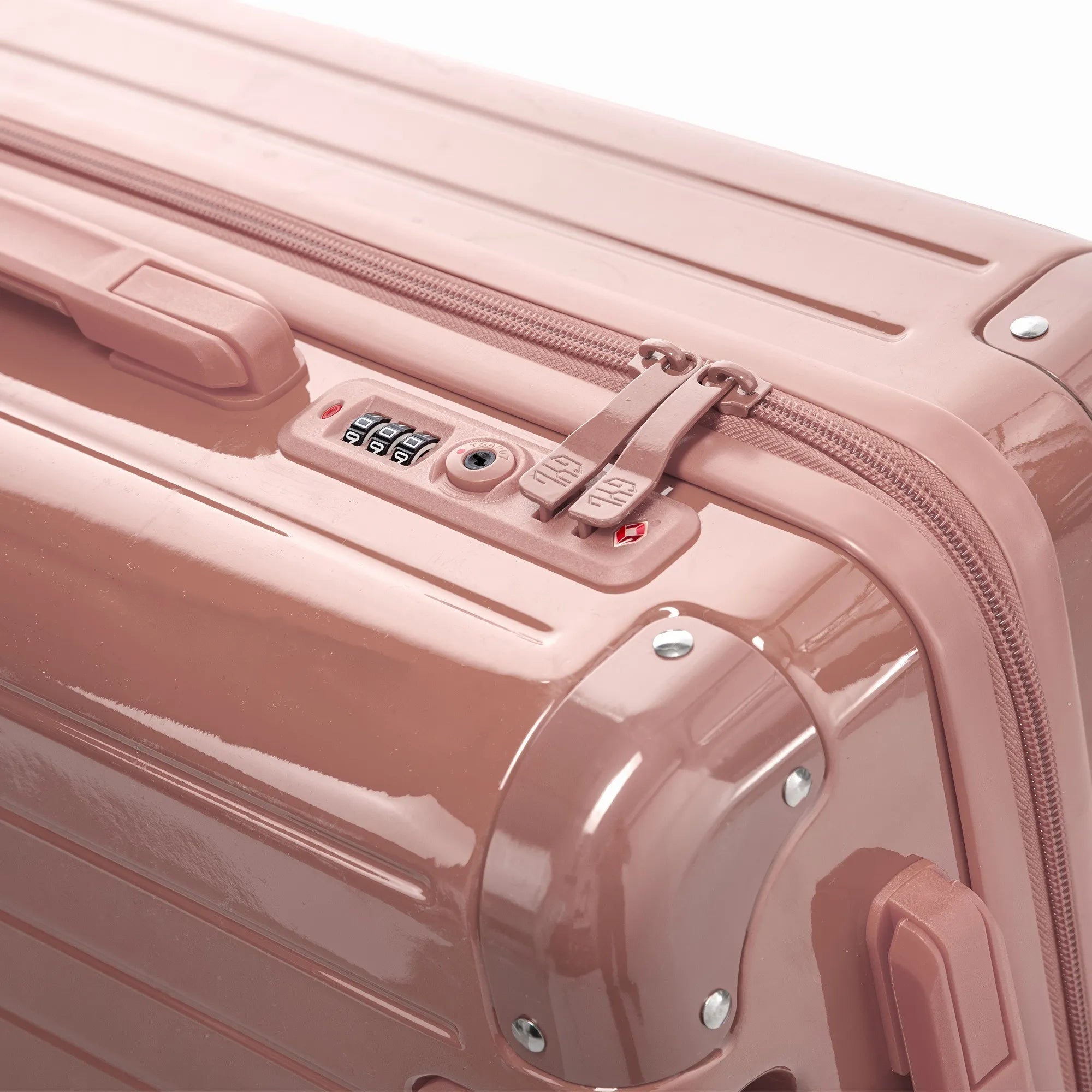 Fermeture à combinaison TSA et double curseur zippé GYL sur la valise rigide orange rose gold.