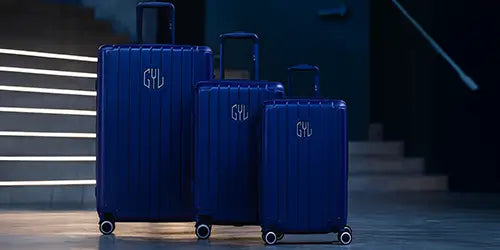 Ensemble de 3 valises GYL en polycarbonate bleu nuit, comprenant cabine, taille moyenne et grande valise, idéales pour tous types de voyages.