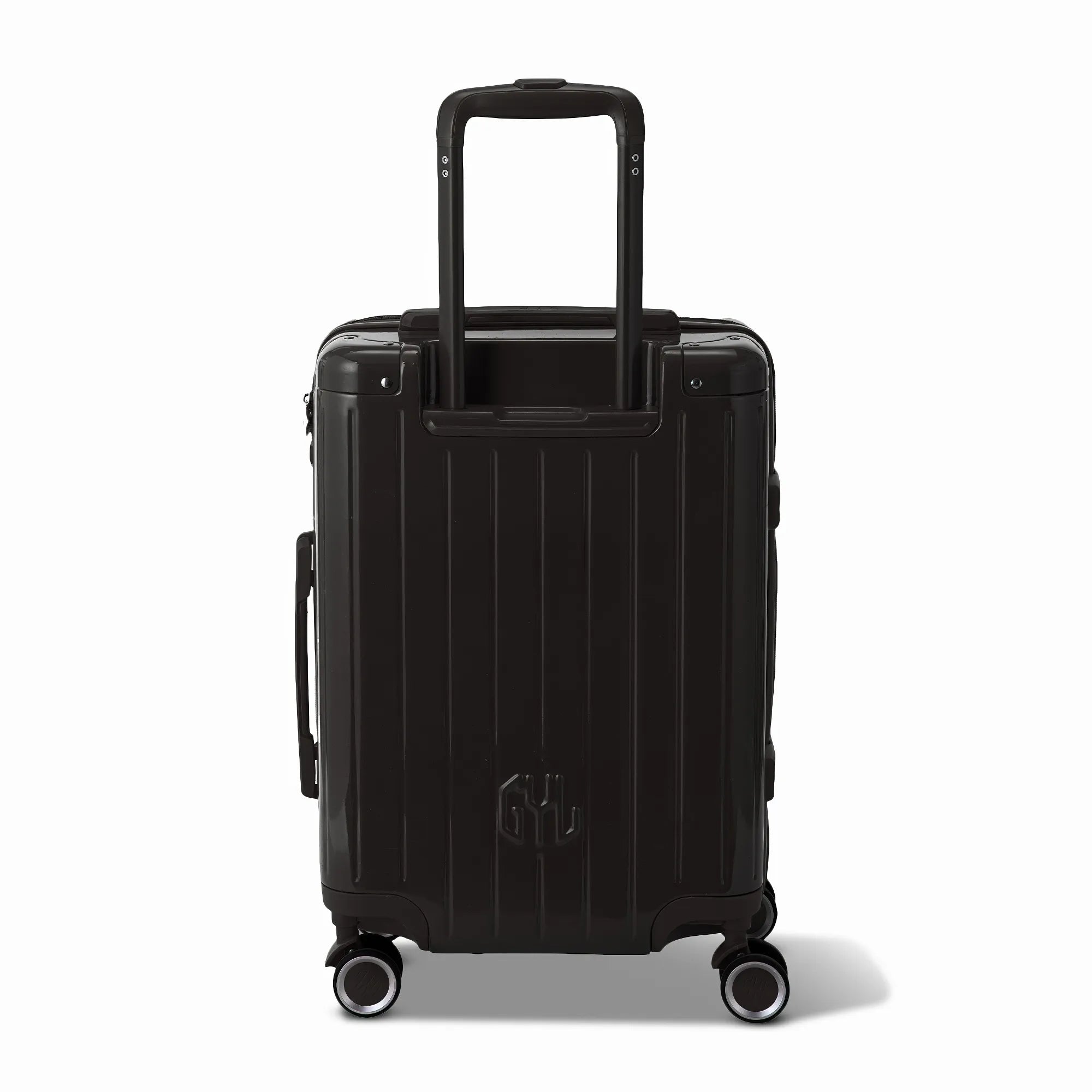 Vue arrière de la valise rigide GYL Intemporelle noir avec poignées intégrées et roulettes pivotantes.