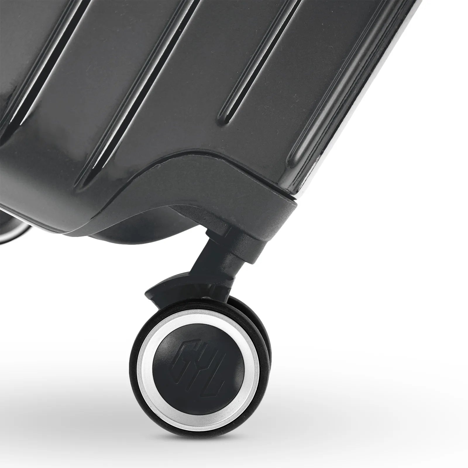 Roue double 360° de la valise GYL Intemporelle gris foncé avec gravure du logo GYL sur le moyeu.