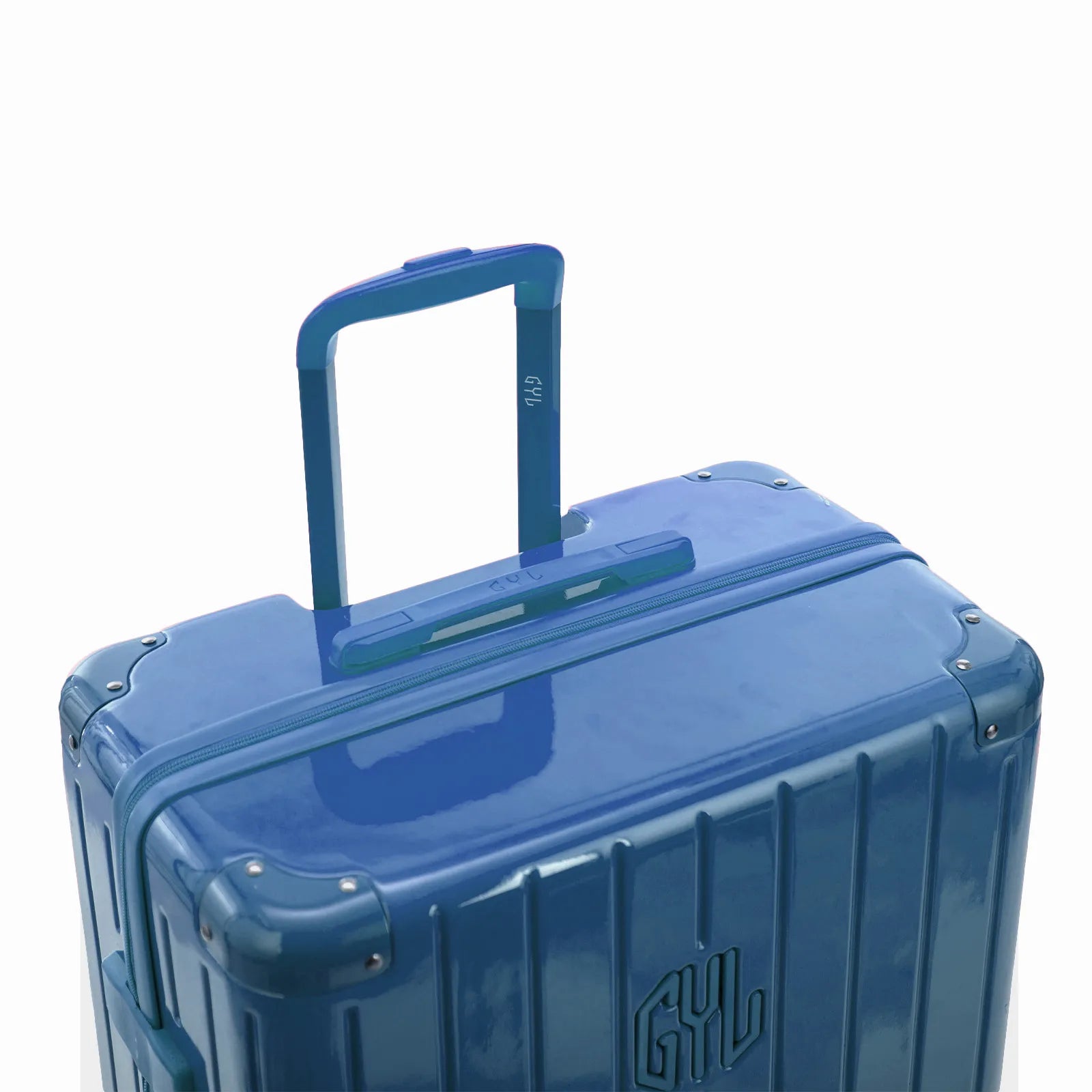 Poignée trolley télescopique GYL déployée sur la valise Intemporelle bleu grisé en polycarbonate.