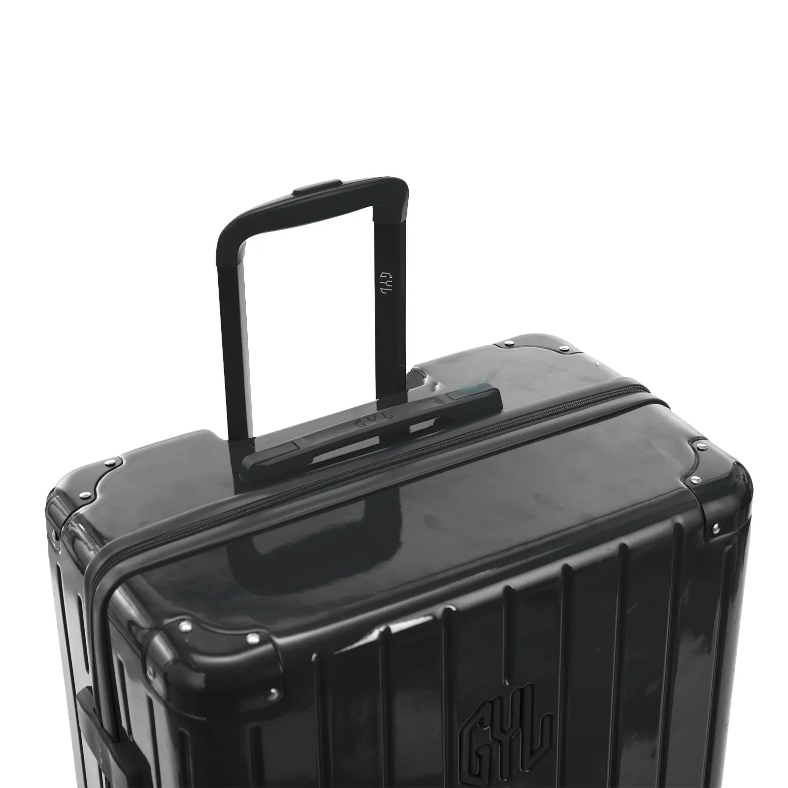 Poignée trolley télescopique GYL déployée sur la valise Intemporelle gris foncé en polycarbonate.