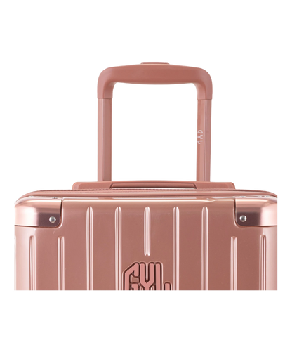 Valise Intemporelle en polycarbonate cabine 55 cm coloris rose gold détail poignée avec logo GYL gravé