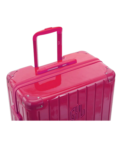 Valise rigide Intemporelle fuchsia vue de dos avec poignees integrees et roulettes pivotantes GYL