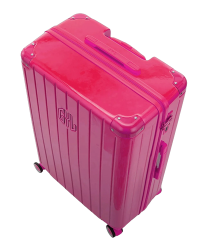 Interieur compartimente de la valise GYL Intemporelle fuchsia avec sangles croisees et poches filet