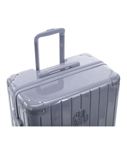 Valise rigide Intemporelle argent vue de dos avec poignees integrees et roulettes pivotantes GYL