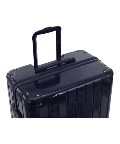Valise rigide Intemporelle marine vue de dos avec poignees integrees et roulettes pivotantes GYL