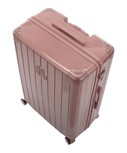 Poignee trolley telescopique GYL deployee sur la valise Intemporelle rose gold grande taille