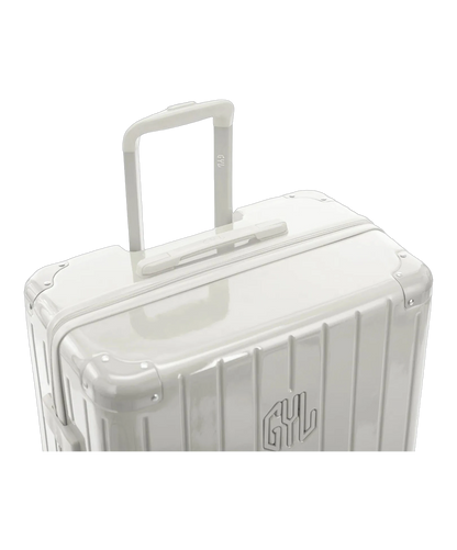 Valise rigide Intemporelle sable vue de dos avec poignees integrees et roulettes pivotantes GYL