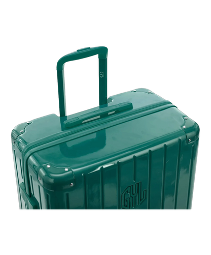 Valise rigide Intemporelle vert pomme vue de dos avec poignees integrees et roulettes pivotantes GYL