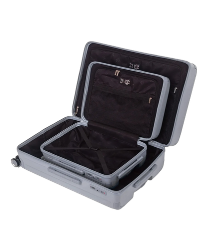 Interieur compartimente de la valise Intemporelle argent avec sangles croisees et poches filet GYL