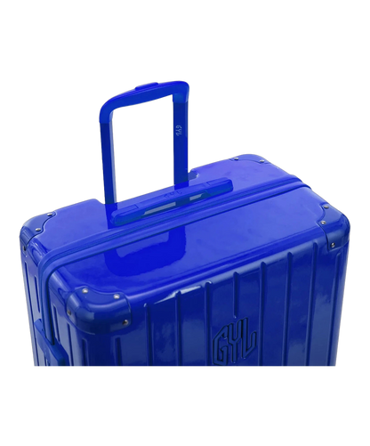 Poignee trolley telescopique GYL deployee sur la valise Intemporelle bleu en polycarbonate