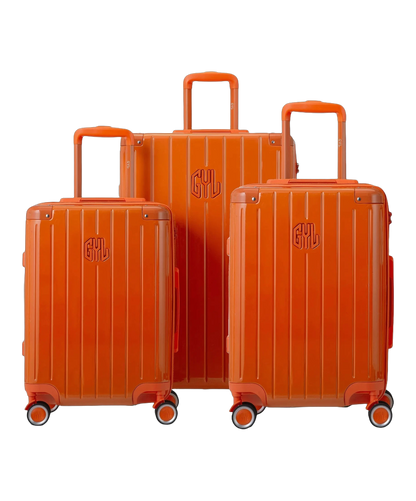 Set de 3 valises rigides Intemporelle orange fonce vue trois quarts avec poignees telescopiques GYL