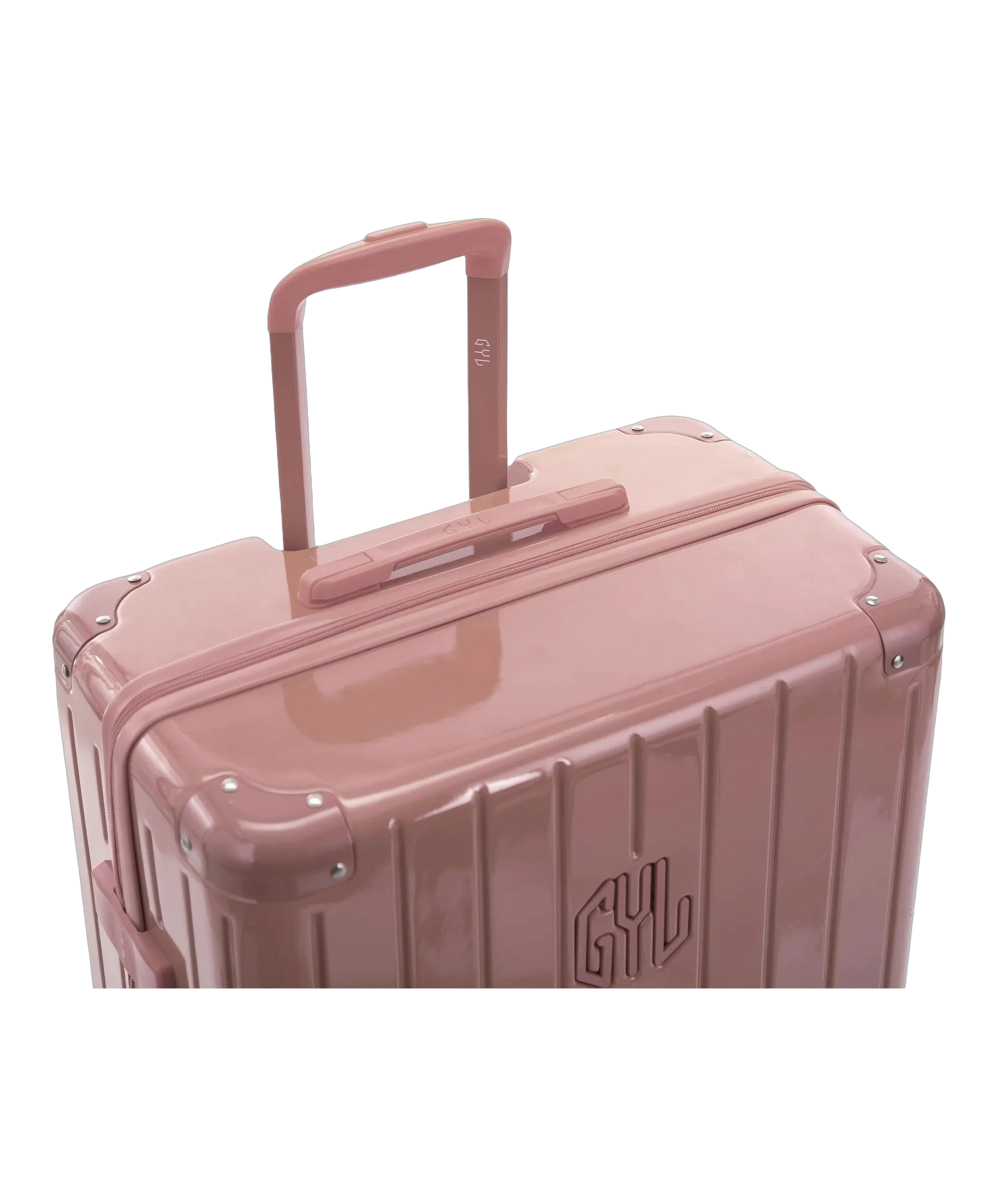 Poignee trolley telescopique GYL deployee sur la valise Intemporelle rose gold en polycarbonate