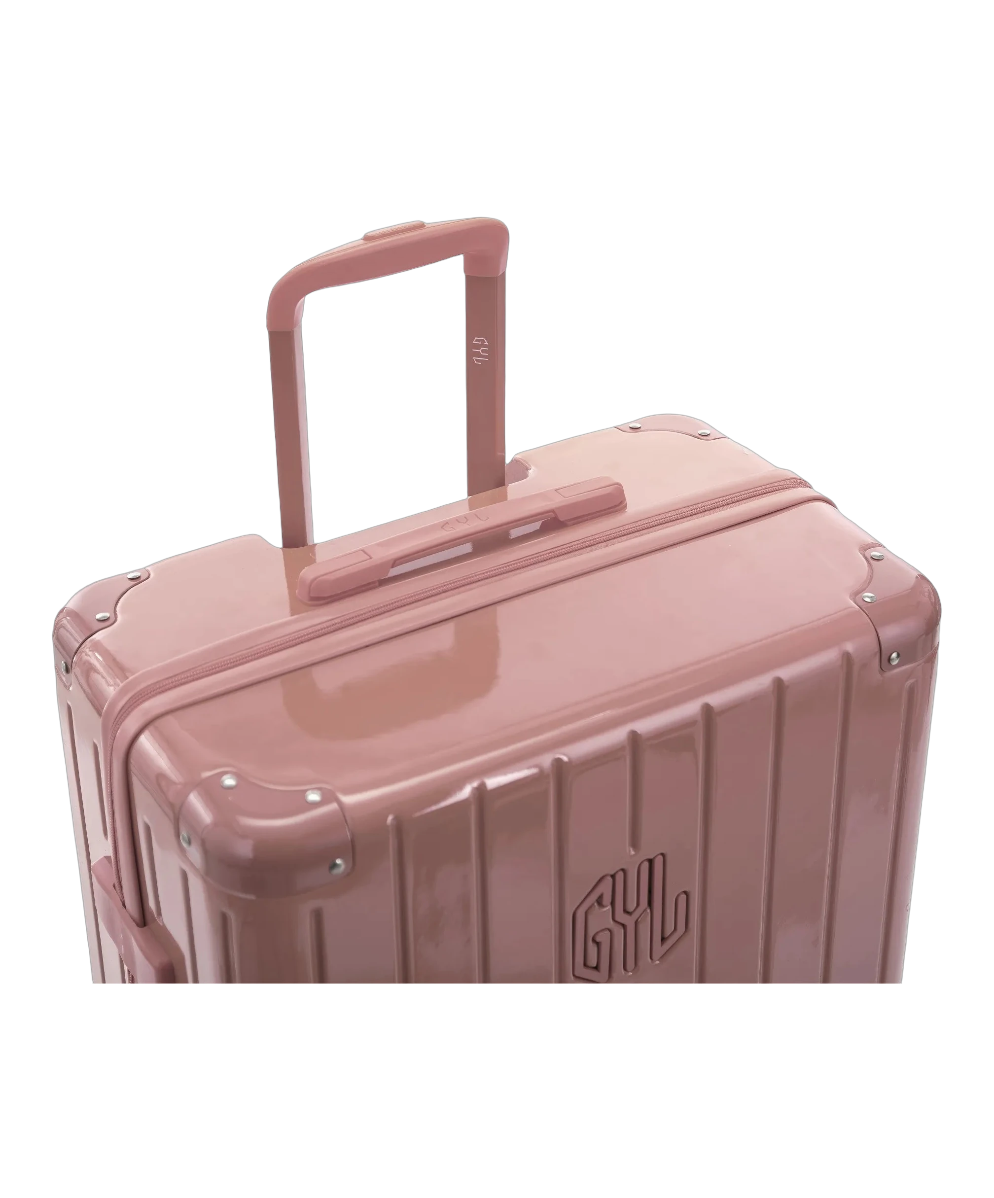 Poignee trolley telescopique GYL deployee sur la valise Intemporelle rose gold en polycarbonate