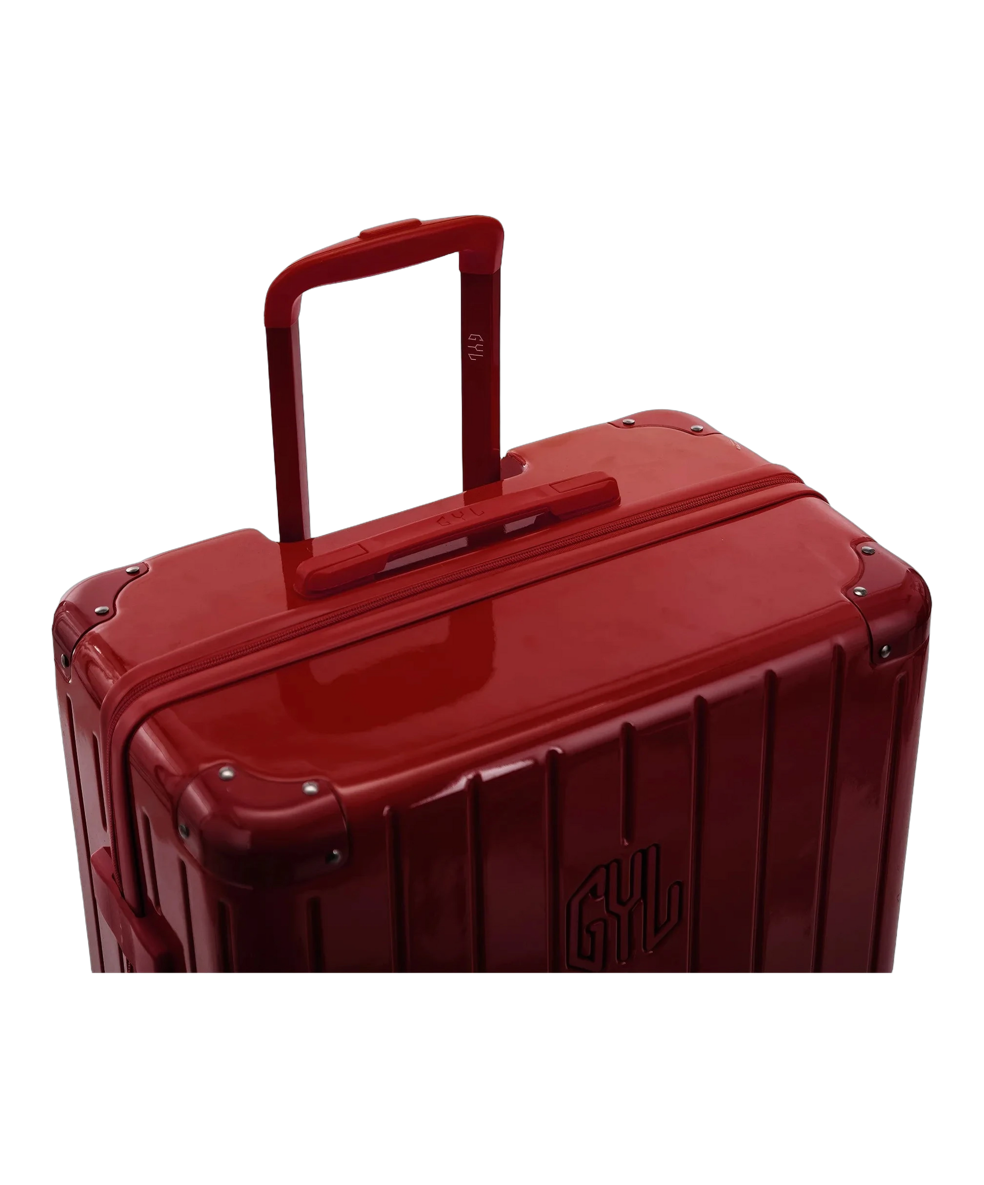 Poignee trolley telescopique GYL deployee sur la valise Intemporelle rouge fonce en polycarbonate