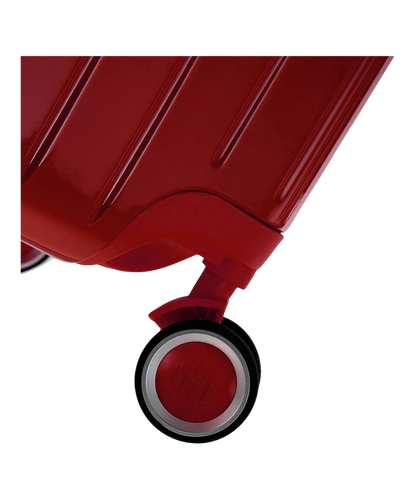 Roue double 360 de la valise GYL Intemporelle rouge fonce avec gravure du logo sur le moyeu