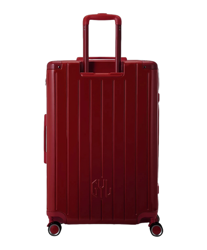 Valise rigide Intemporelle rouge fonce vue de dos avec poignees integrees et roulettes pivotantes GYL