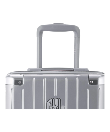Valise Intemporelle en polycarbonate set de 3 valises cabine semaine et soute coloris argent detail poignee telescopique et logo GYL