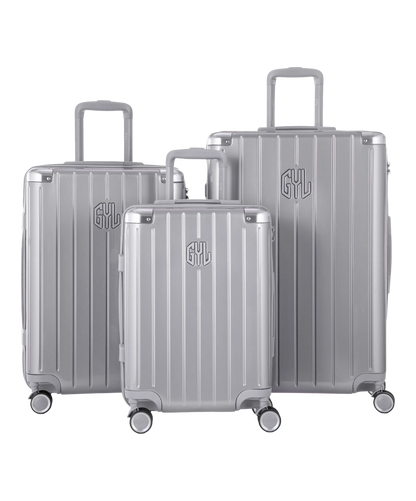 Valise Intemporelle en polycarbonate set de 3 valises cabine semaine et soute coloris argent vue de face du set complet
