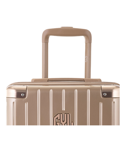 Valise Intemporelle en polycarbonate set de 3 valises cabine semaine et soute coloris champagne detail poignee telescopique et logo GYL