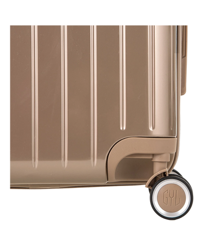 Valise Intemporelle en polycarbonate set de 3 valises cabine semaine et soute coloris champagne detail roulette 360 degres sigle GYL