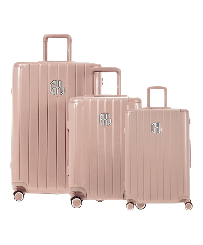 Trio de valises rigides GYL Intemporelle nude avec coques nervurées et poignées télescopiques. #couleur_nude