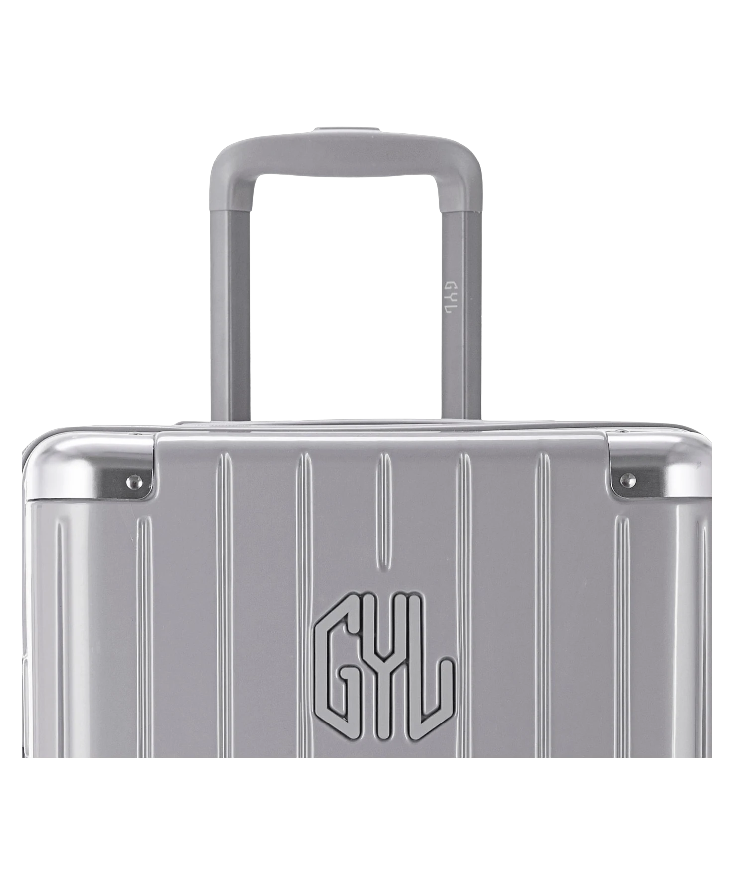Valise Trunk L Intemporelle GYL en polycarbonate 71 cm coloris argent gros plan sur la poignee trolley et les coins renforces
