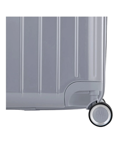 Detail de la roue et du logo GYL sur le bas de la valise trunk L argent