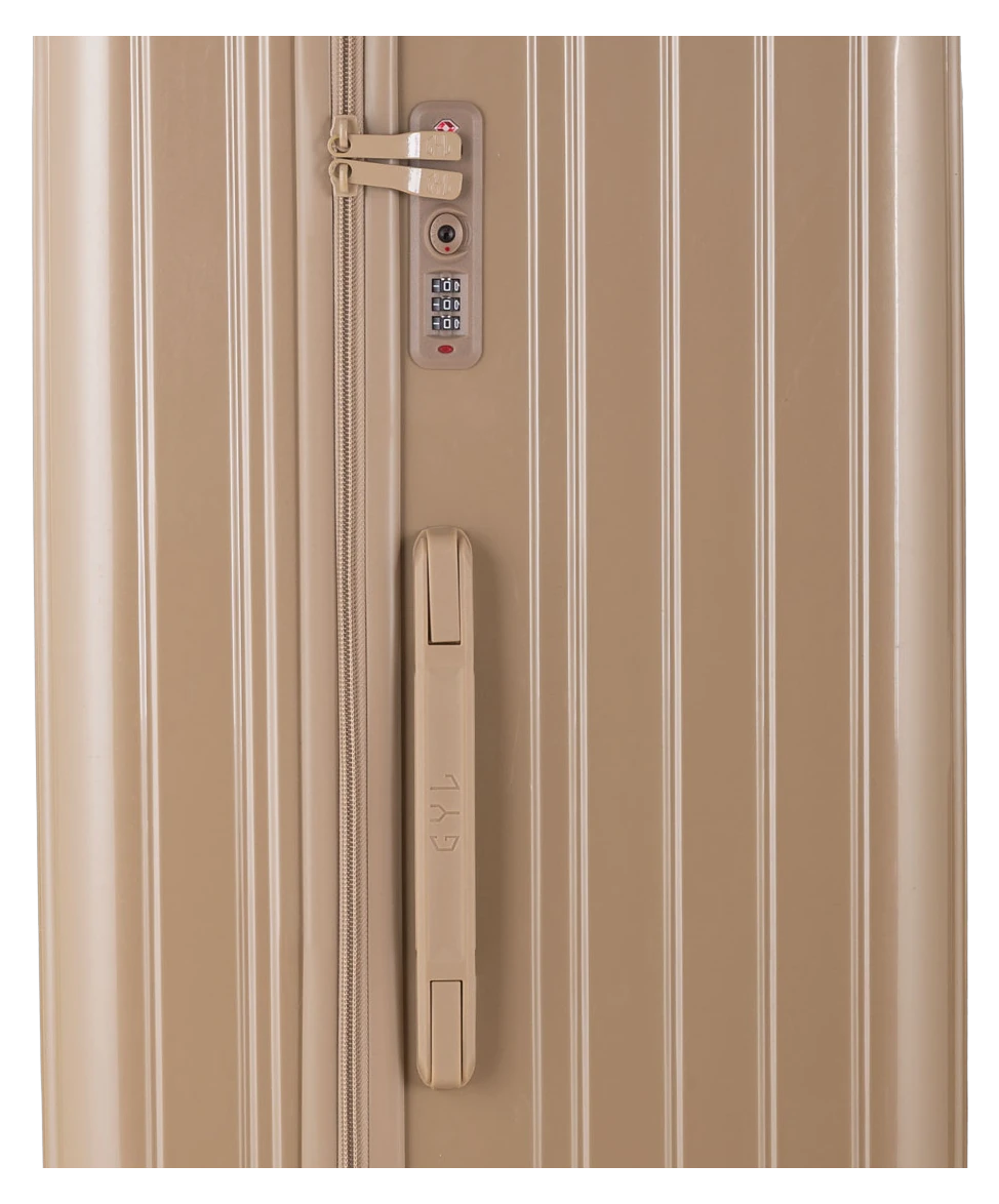 Valise Trunk L Intemporelle GYL en polycarbonate 71 cm coloris champagne gros plan sur la serrure TSA et la fermeture eclair