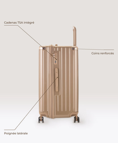 Valise Trunk L Intemporelle GYL en polycarbonate 71 cm coloris champagne, vue de profil, cadenas TSA integre, poignee laterale et coins renforces