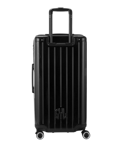 Valise Trunk L Intemporelle GYL en polycarbonate 71 cm coloris noir vue de dos avec trolley telescopique deploye